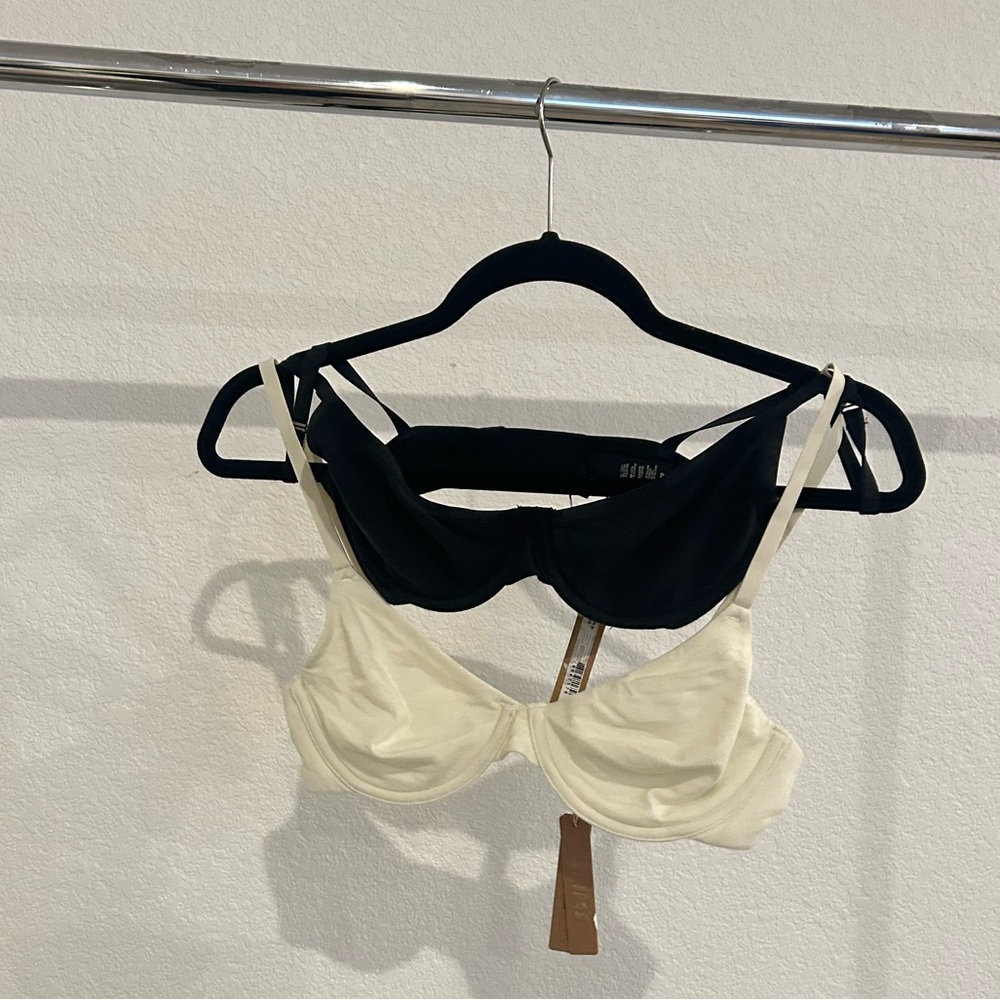 SKIMS TWO Black and Bone Colored lightly lined T-shirt Bras.